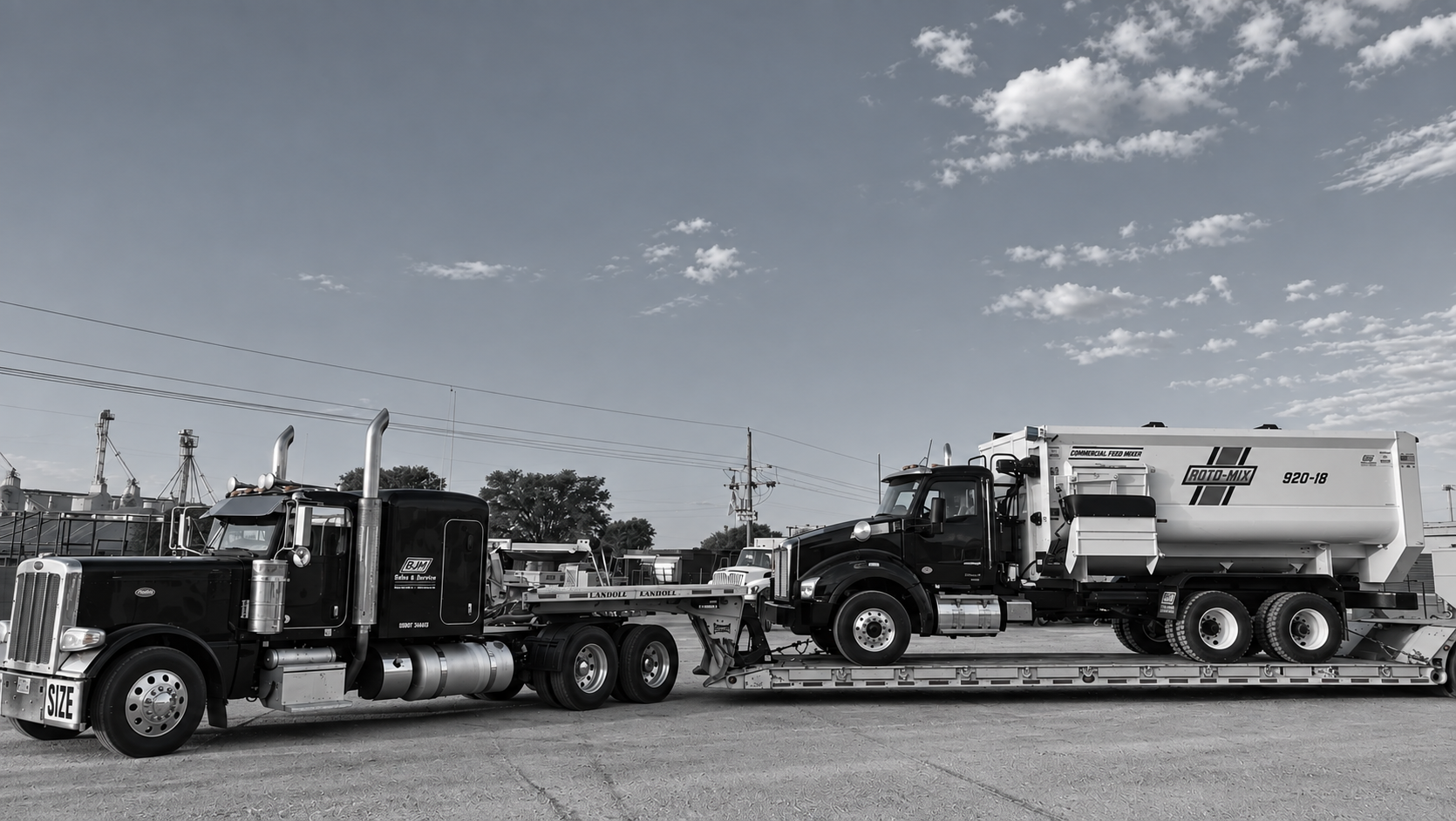 BJM trucking — equipment haul on flatbed